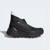 Side profile of the black and lilac Stella McCartney x Terrex Free Hiker, showing the elongated fashion-forward silhouette and the chunky BOOST midsole.