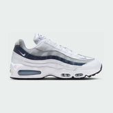 Nike Air Max 95 OG Men's running shoes in white with diffused blue accents, side profile showing visible Max Air units in the heel and forefoot, and a layered upper.