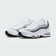 Angled view of two Nike Air Max 95 OG Men's running shoes in white with diffused blue accents, side by side, showcasing their timeless design and layered upper.