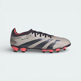 Side profile of the Adidas Predator Pro Men's boots in Platinum Metallic, showing the Aurora Black 3-Stripes and the vibrant Turbo pink detailing on the Primeknit collar.