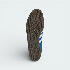 View of the classic gum rubber outsole, showcasing the heritage traction pattern and the high-quality finish.
