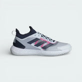 Side profile of the adidas Adizero Ubersonic 4.1 Clay in Halo Blue, showing the Dark Blue stripes and the vibrant Team Shock Pink Lightstrike midsole.