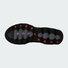 View of the outsole of the Nike Air Max DN Men's black running shoes, showing the durable rubber tread pattern and the unique design of the visible Dynamic Air pods.