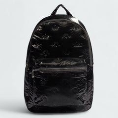 Adidas Puffy Satin Backpack in black, front view showing its sleek, padded silhouette, main zipper, and front zip pocket.
