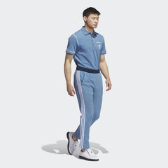 Adidas x Bogey Boys Golf Men's Track Pants in blue, side profile showing the full length, tapered leg, and collaborative branding.
