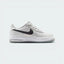 Highlights the high-velocity sweep of the anthracite leather Nike Swoosh, showing the professional, matte texture of the photon dust upper, the flashing contrast of the reflect silver accents, and the thick grey midsole wall.
