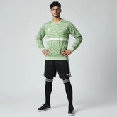 Man wearing the Adidas Handball Goalkeeper Long Sleeve Jersey in green, demonstrating its fit for athletic movement.