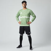 Man wearing the Adidas Handball Goalkeeper Long Sleeve Jersey in green, demonstrating its fit for athletic movement.