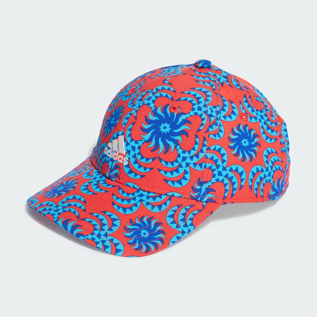 Adidas x Farm Rio cap in a vibrant multi-color graphic print, front view showing the pre-curved brim and embroidered logo.