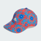 Adidas x Farm Rio cap in a vibrant multi-color graphic print, front view showing the pre-curved brim and embroidered logo.