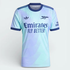Light blue sports jersey with Adidas logo and Emirates branding on a white background