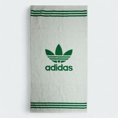 Fully unfolded Adidas Cotton Towel in white, displaying its entire 50 cm x 100 cm surface and soft texture.