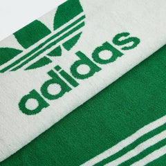 Adidas Cotton Towel in crisp white, neatly folded, showing the soft cotton texture and embroidered Adidas logo.