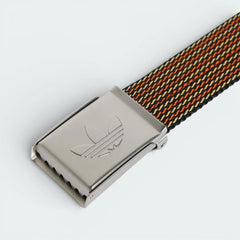 Extreme close-up of the silver-toned buckle, focusing on the precision-embossed Trefoil logo and the polished metallic finish.