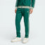 Front profile of the Collegiate Green adidas Beckenbauer track pants, highlighting the Silver Green 3-Stripes running down the leg.