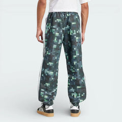 Rear view of the track pants, highlighting the clean finish of the Legend Ivy green and the structured fit.
