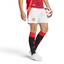 The White Man Utd shorts, highlighting the vibrant red Adidas 3-Stripes and the high-definition embroidered club crest.