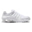 Lateral view showing the streamlined white synthetic leather chassis, tonal micro-perforations, embroidered white mini Swoosh, four independent polyurethane Nike Shox heel columns, sculpted forefoot foam midsole, and white tacky rubber Waffle outsole.