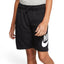 Front-on view of a young model wearing the black jersey shorts paired with a grey t-shirt, highlighting the comfortable mid-thigh fit.