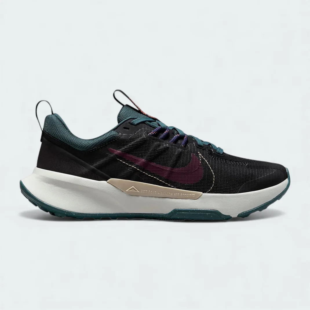 Nike Juniper Trail 2 Women's trail shoes in black with night maroon and deep jungle accents, side profile showing mesh upper, rugged overlays, and aggressive outsole.