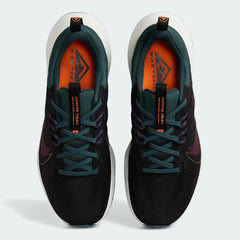 Top-down view of a pair of Nike Juniper Trail 2 Women's trail shoes in black, maroon, and green, highlighting their durable construction and lace-up closure.