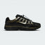 Highlights the lateral profile featuring a metallic silver Nike Swoosh with gold-khaki trim, showing the black mesh upper, olive-green Cargo Khaki overlays, silver reflective accents, speed-cord toggle lacing, and the dark foam midsole.