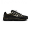 Highlights the lateral profile featuring a metallic silver Nike Swoosh with gold-khaki trim, showing the black mesh upper, olive-green Cargo Khaki overlays, silver reflective accents, speed-cord toggle lacing, and the dark foam midsole.
