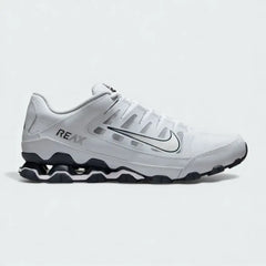 Nike Reax 8 Training Shoes Men's in white with metallic silver accents, side profile showing mesh upper, distinctive Reax cushioning pillars in the heel, and Nike Swoosh.