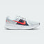 Highlights the high-velocity sweep of the contrasting Chile Red Nike Swoosh, showing the professional, multi-textured grey mesh upper, the Obsidian navy midfoot paneling, and the clean white foam midsole wall.