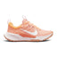 Studio lateral shot of the Nike Women's Juniper Trail 2 Next Nature running shoes in Arctic Orange, White, and Venice, highlighting the durable mesh upper, white Swoosh branding, supportive foam midsole, and rugged traction outsole.