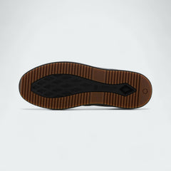 View of the outsole of the Timberland X Champion City Roam black boots, showing the durable rubber outsole with a unique lug pattern for traction.