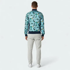 Man wearing a floral patterned jacket and light gray pants on a white background