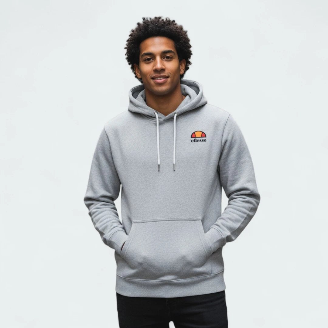 Ellesse Toce Overhead Hoodie Men's in light grey, worn by a model with hands inside the kangaroo pockets