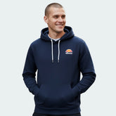 Model wearing the Toce pullover hoody and the regular fit and demonstrating the kangaroo pockets
