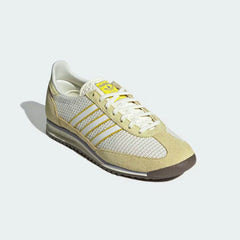 Emphasising the contrast between the ivory nylon and the premium yellow suede overlays.