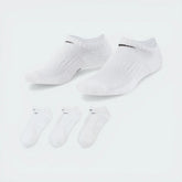 The white no-show sock, highlighting the high-contrast black Nike Swoosh on the top of the foot.