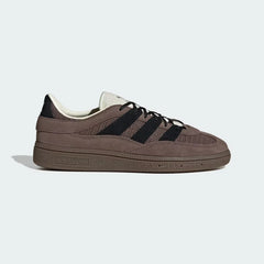 The Earth Strata Spezial ST, highlighting the textured textile panels and the contrast Core Black 3-Stripes.