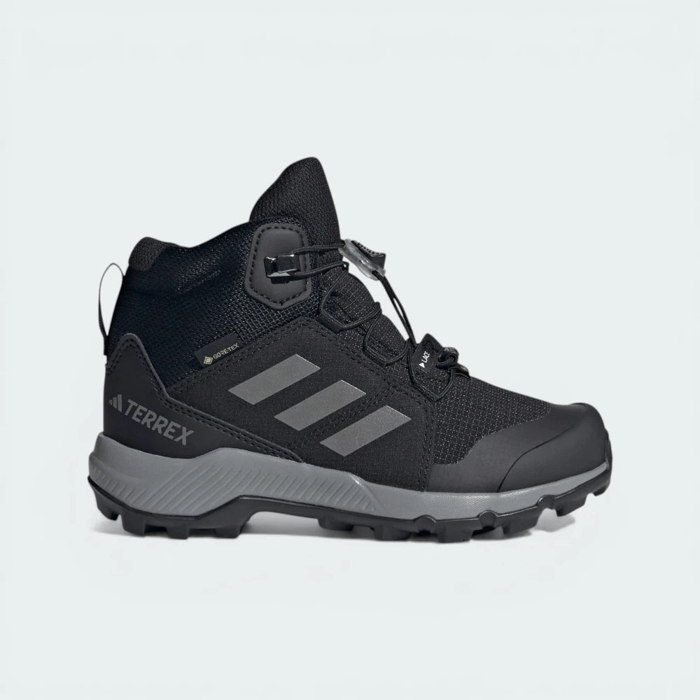 Side profile of the Core Black Adidas Terrex, highlighting the rugged silhouette and the GORE-TEX branding on the upper.