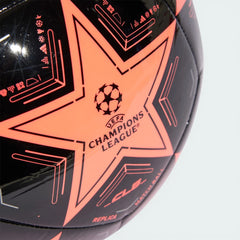Zoom looking at the front of the ball and the printed UCL logo, highlighting the texture of the recycled TPU cover.