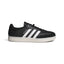 Side Profile Image: Studio lateral shot of the adidas Velosamba Leather Shoes in Core Black and Cloud White, highlighting the black leather upper, white serrated three stripes, gold foil VELOSAMBA branding, and the clean white-grey sole.