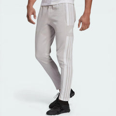 Side profile of the Team Light Grey Squadra 21 pants, highlighting the tapered leg and the white 3-Stripes branding.
