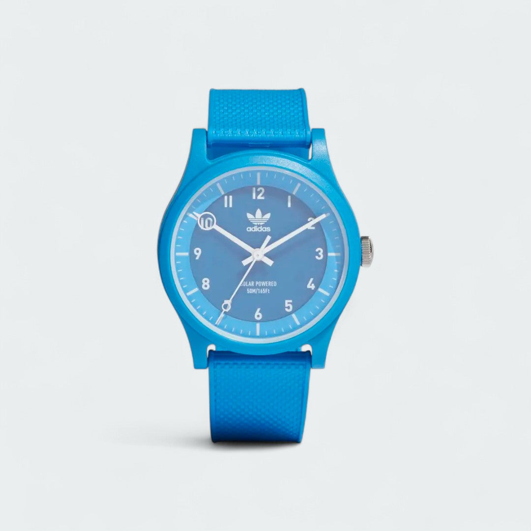 Adidas Originals Project One R Watch in blue, front view showing the digital display with a white Trefoil logo on the face.