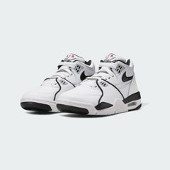 Angled view of two Nike Air Flight 89 Juniors' white basketball trainers, side by side, showcasing their iconic retro design and supportive build.