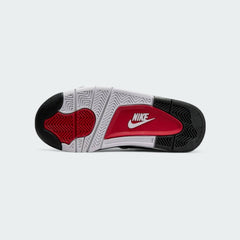 View of the outsole of the Nike Air Flight 89 Juniors' white trainers, showing the durable rubber sole with pivot circles for court traction.