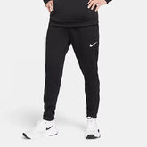 Person wearing black Nike jogger pants and white sneakers on a light gray background