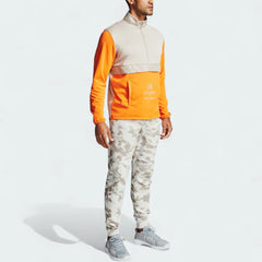 Full size model worn Under Armour Rival Fleece Camo Track Pants in onyx white, showing the soft fleece texture and the camouflage print.