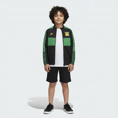 Child wearing a green and black Adidas tracksuit on a white background