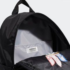 Inside view of the Adidas Originals Adicolor Classic Small Backpack's main compartment open, showing its compact storage space.