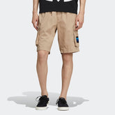 adidas Adiplore Men's Cargo Utility Shorts GP1120 worn standing showing relaxed fit and outdoor style