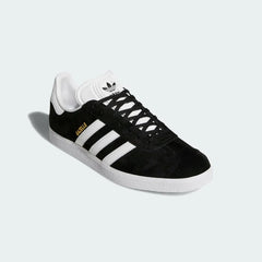 Angled side view of adidas Originals Gazelle Men's sneakers highlighting colour contrast and slim silhouette